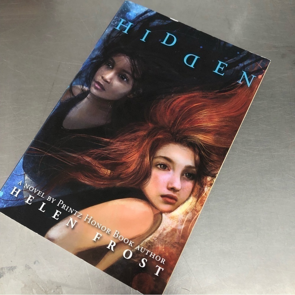 Hidden by: Helen Frost, paperback book